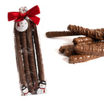 Milk chocolate Christmas pretzel rods in bag white background